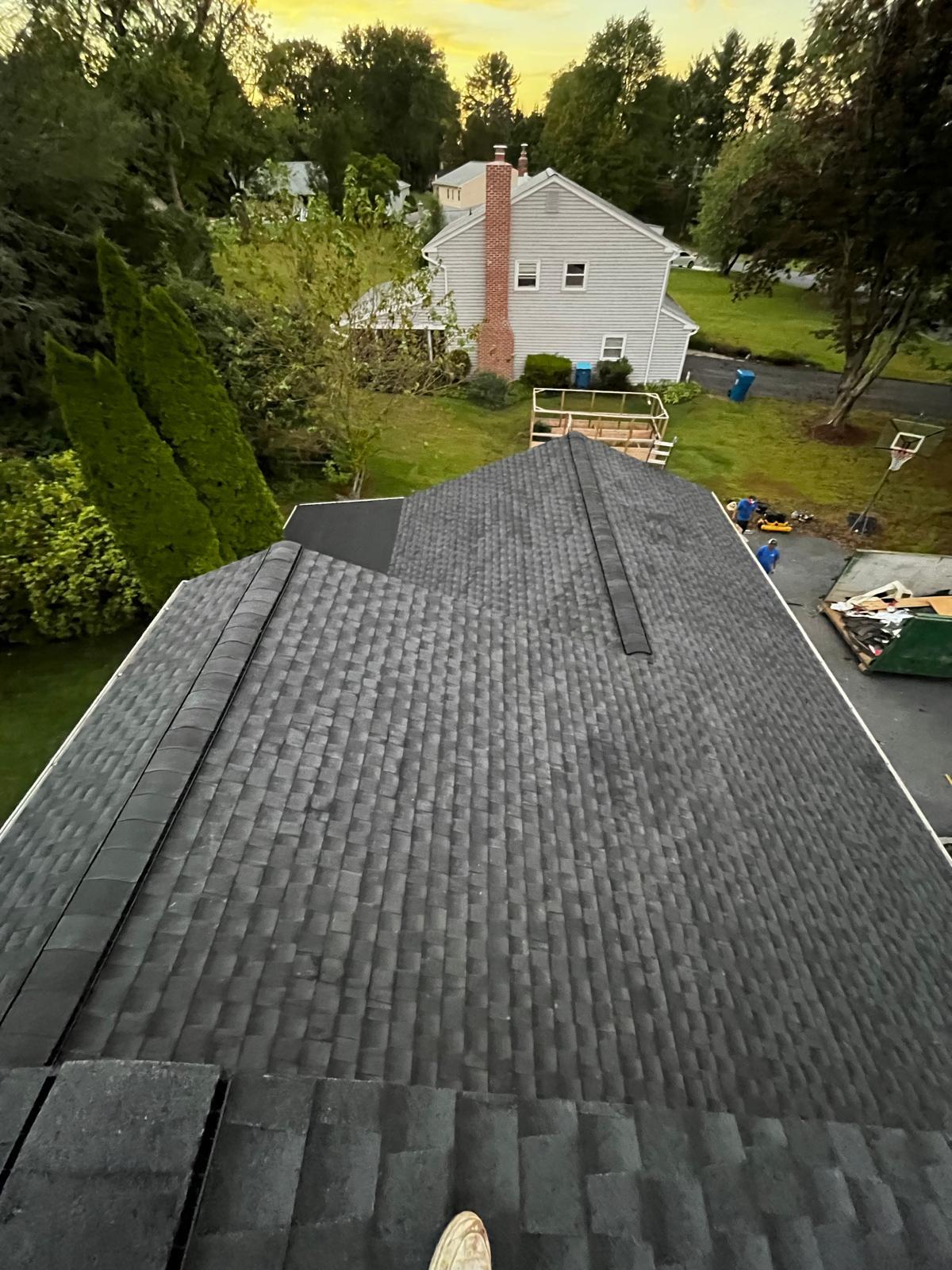 Roofing crew working at golden hour
